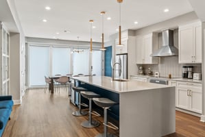 A beautfifully designed modern kitchen with elegant lighting fixtures installed by Wilcox Electric DC