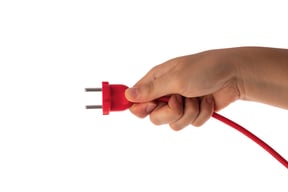 Hand-Holding-Electric-Power-Plug-wilcox-electric-dc